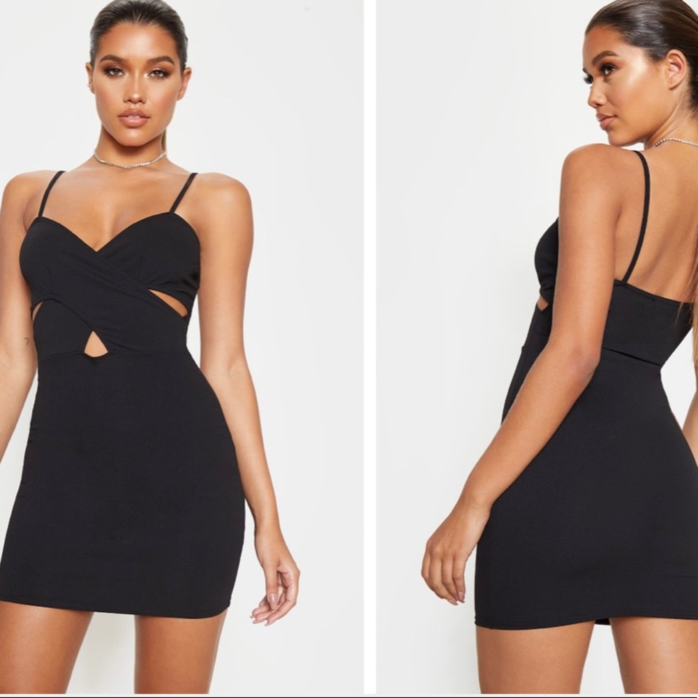 Never worn black strappy cross front bodycon!